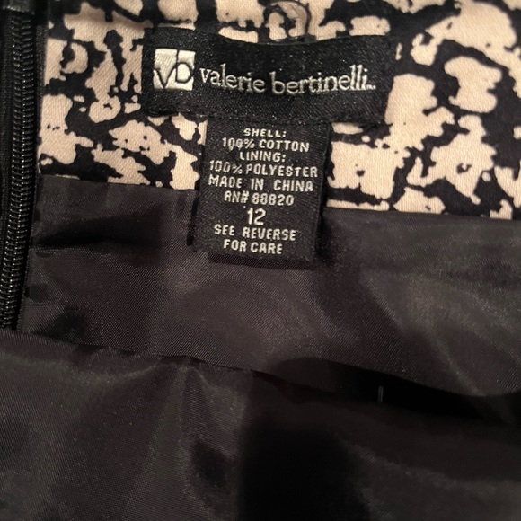 Lined skirt. Tan/Khaki with Black design. Back zipper. Back slit. - Picture 4 of 6